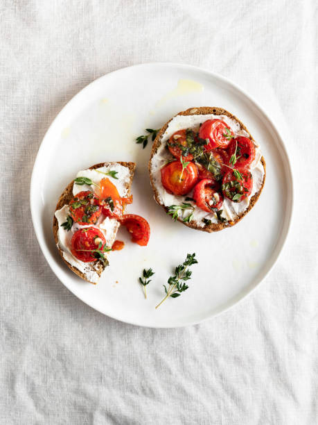 Style toast topped with Greek yoghurt, cherry tomatoes, and fresh herbs.