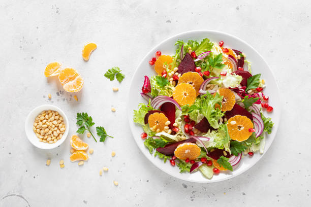 Bright citrus arugula salad with oranges, beets, red onions, and mixed greens.