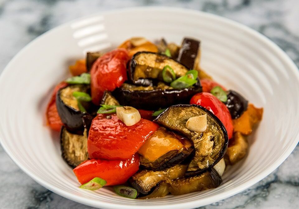 Delicious roasted Italian vegetables with eggplant, peppers, and tomatoes. Perfect healthy side dish.