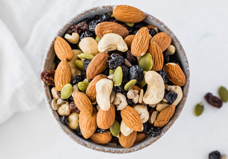 Healthy trail mix with nuts, dried fruits, and seeds for a nutritious snack. Perfect for on-the-go e.