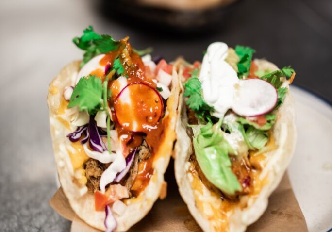 Delicious fish tacos with fresh vegetables and flavorful sauces. Perfect for a healthy, tasty meal.