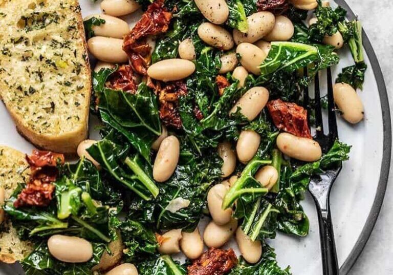 Fresh kale and white bean salad with sun-dried tomatoes and herbs.