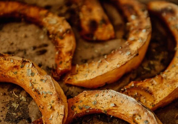 Roasted butternut squash slices seasoned with herbs, perfect for healthy meals and nutritious snacks.