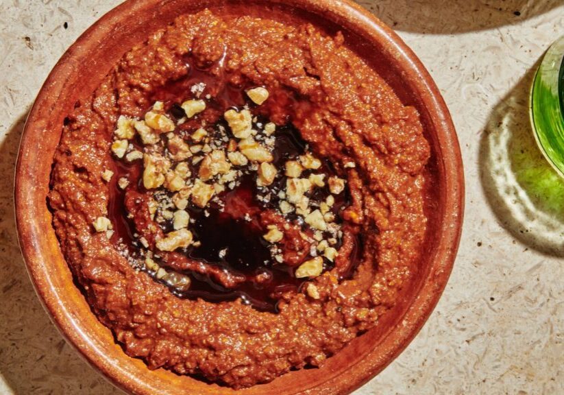 Traditional Muhammara dip with roasted peppers, walnuts, and pomegranate molasses.