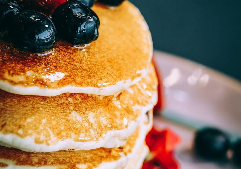 Flaxseed pancakes topped with blueberries, perfect gluten-free breakfast option.